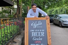 Kae Kae posing infront of a Traditional Pub